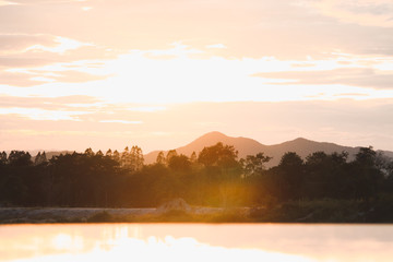 Sun setting over the mountains in Thailand