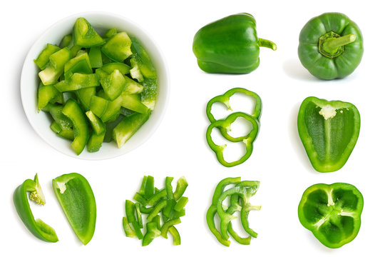 Set of fresh whole and sliced green bell pepper isolated on white background. Top view