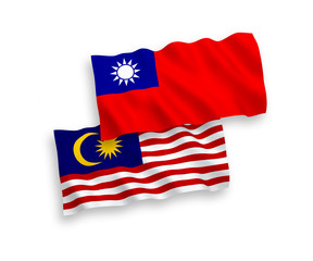 National vector fabric wave flags of Taiwan and Malaysia isolated on white background. 1 to 2 proportion.