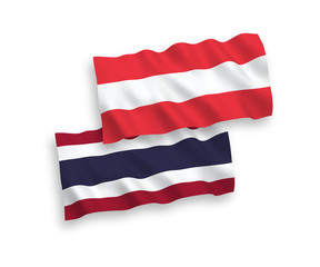 National vector fabric wave flags of Austria and Thailand isolated on white background. 1 to 2 proportion.