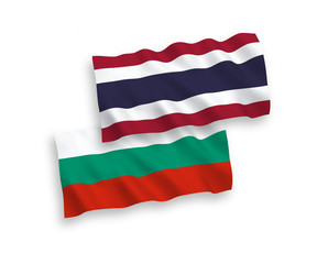 National vector fabric wave flags of Bulgaria and Thailand isolated on white background. 1 to 2 proportion.
