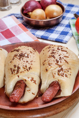 Sausage baked in dough.