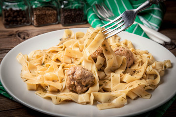 Tagliatelle pasta with beef meatballs.