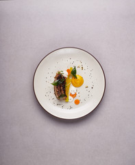 Beautiful and tasty food on a plate, exquisite dish, creative restaurant meal concept.