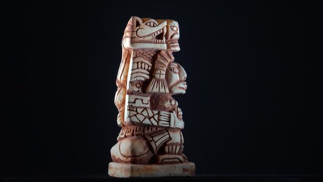 Mayan statue background.Pan Rotating Video Clip Footage of of a mayan statue