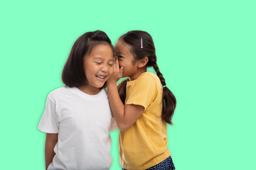 Little asian two girls laughing and smiling enjoy friendship together isolated from background