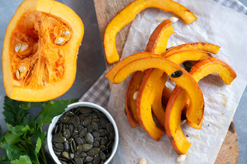Roasted pumpkin slices with pumpkin seeds.