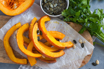 Roasted pumpkin slices with pumpkin seeds.