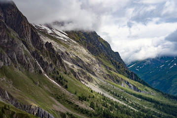 Obraz na płótnie Canvas Clouds over italian Alps in Mont Blanc surroundings.