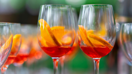 Making of Apperol Spritz coctails with orange