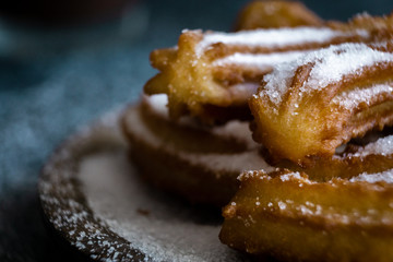 Typical churros with sugar and hot chocolate in a autumn morning