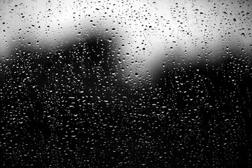 Naklejka na ściany i meble texture of a drop of rain on a glass wet transparent background