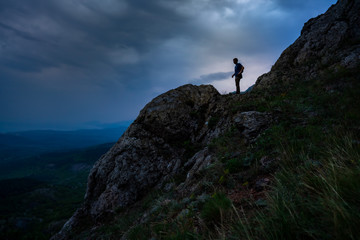 Hiker is looking on valley from Mountain in Crimea, Travel during Summer