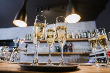 A glasses with champagne on the table at the restaurant. Preparation to celebrate