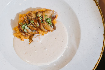A dish with fish, bulgur and sauce