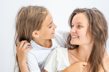 Mother and daughter have fun at home. Happy family concept
