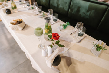 Served table at the restaurant with different decorations on the table. Preparing to celebration