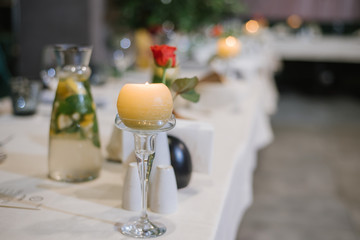 Served table at the restaurant with different decorations on the table. Preparing to celebration