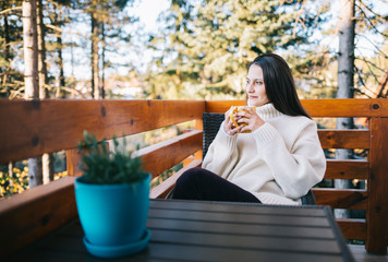  Girl enjoy hot drink on balcony