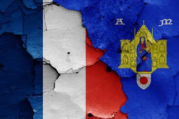 flags of France and Montpellier painted on cracked wall