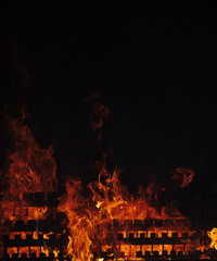 NB__8222 Fire flames with melting candles in Fatima