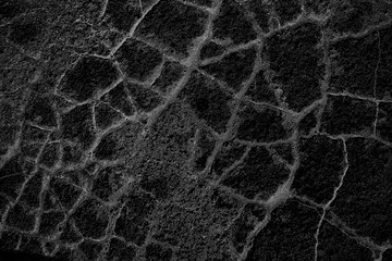 asphalt in cracks texture / abstract background cracks on asphalt road