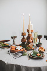 Table served for Christmas dinner in living room, close up view.