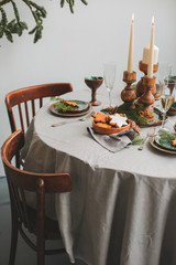 Table served for Christmas dinner in living room, close up view.