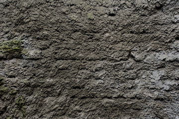 Background of a gray stucco coated and painted exterior, rough cast of cement and concrete wall texture, decorative coating
