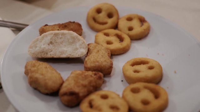 Round cookies on a white plate with a smile