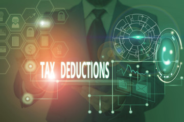 Writing note showing Tax Deductions. Business concept for an amount or cost that subtracted from someone s is income Picture photo network scheme with modern smart device
