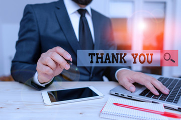 Conceptual hand writing showing Thank You. Concept meaning a polite expression used when acknowledging a gift or service Male human wear formal clothes present use hitech smartphone