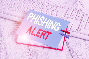 Writing note showing Phishing Alert. Business concept for aware to fraudulent attempt to obtain...