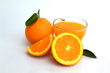 Fototapeta na wymiar glass of orange juice and oranges isolated on white background