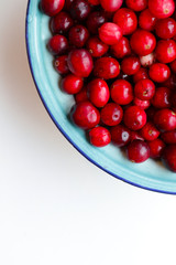 lot of fresh cranberries in a bowl close up