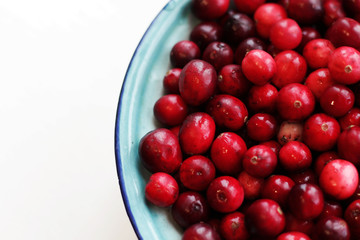 lot of fresh cranberries in a bowl close up