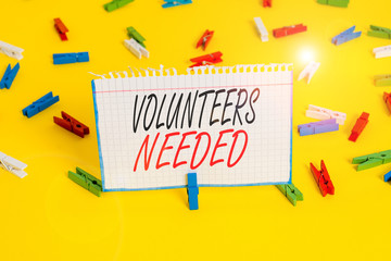 Writing note showing Volunteers Needed. Business concept for need work or help for organization...