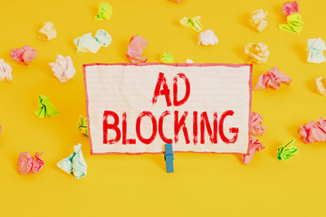 Conceptual hand writing showing Ad Blocking. Concept meaning program that will remove different kinds of advertising from web Colored crumpled paper empty reminder white floor clothespin