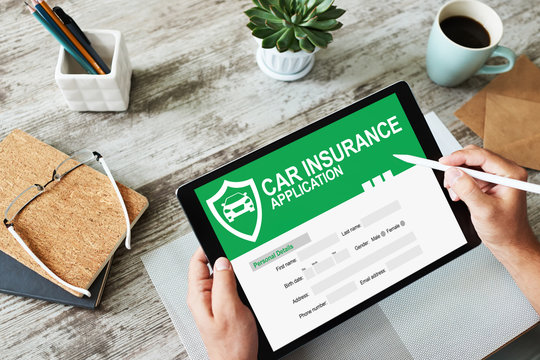 Car insurance application form on screen. Internet and business concept.