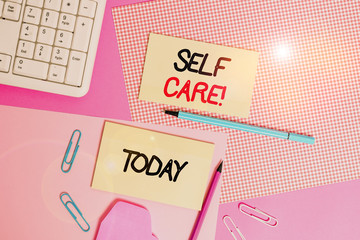Word writing text Self Care. Business photo showcasing the practice of taking action to improve one s is own health Writing equipments and computer stuffs placed above colored plain table