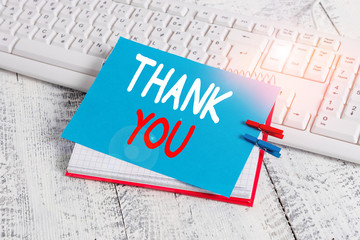 Writing note showing Thank You. Business concept for a polite expression used when acknowledging a...