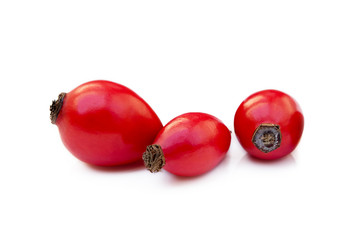 Ripe rose hip isolated on white background