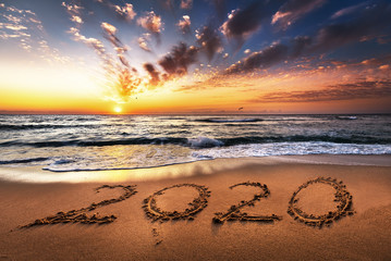 Happy New Year 2020 is coming concept, ocean beach lettering.