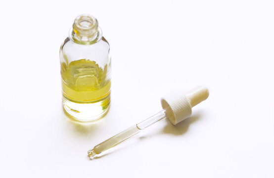 glass oil bottle and pipette
