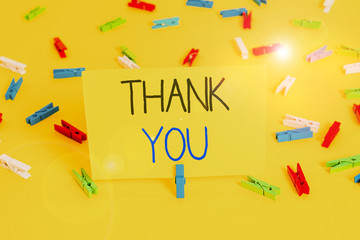 Text sign showing Thank You. Business photo text a polite expression used when acknowledging a gift or service Colored clothespin papers empty reminder yellow floor background office