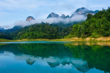 Beautiful view of mountains and clouds reflection on water surface. Ratchaprapa dam photography 