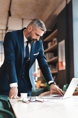business man working with documents and laptop