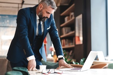 business man working with documents and laptop