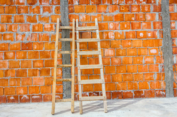 Wooden ladder pointing towards on next level