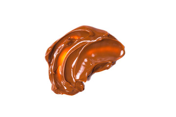 Melted tasty caramel splashes isolated on white background.